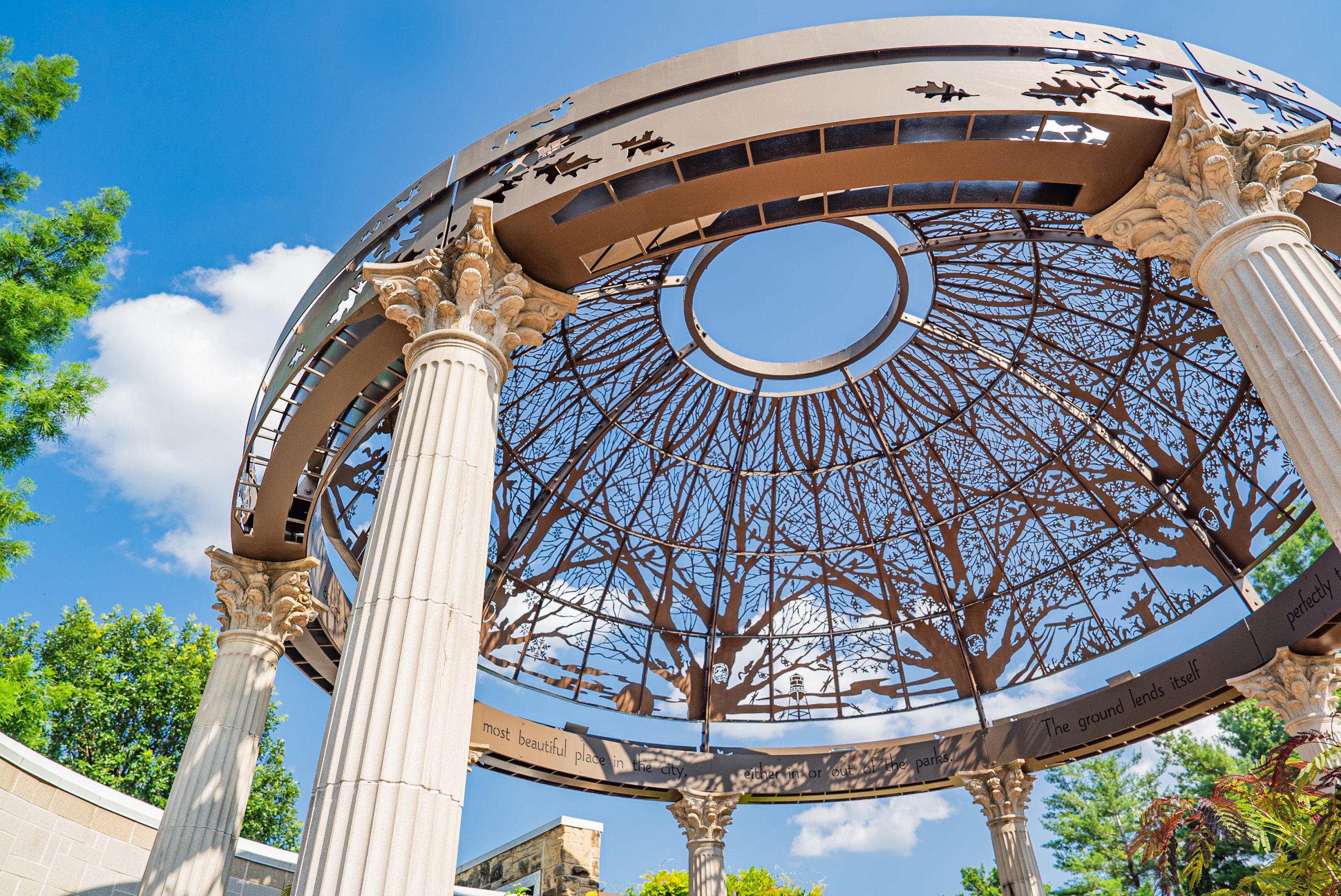 Metal Art Display at the Lincoln Children's Zoo. A close up of a dome top made out of etched metal in the design of trees.